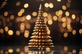 golden christmas tree on black background with bokeh lights Royalty Free Stock Photo