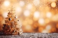 Golden Christmas tree decorated with bauble balls on gold color bokeh festive lights background. Merry Christmas and Happy New Royalty Free Stock Photo