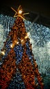 Golden Christmas tree Star bulbs glowing