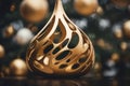 a golden christmas tree ornament with a tear drop shape