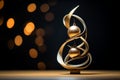 a golden christmas tree with two ornaments on it Royalty Free Stock Photo
