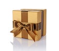 Golden classic shiny gift box with brown satin bow Royalty Free Stock Photo