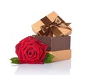 Golden classic shiny gift box with brown satin bow and red rose Royalty Free Stock Photo