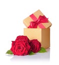 Golden classic shiny gift box with red satin bow and bouquet of roses Royalty Free Stock Photo