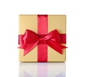 Golden classic shiny gift box with red satin bow Royalty Free Stock Photo