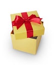 Golden classic shiny gift box with red satin bow Royalty Free Stock Photo