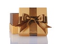 Golden classic shiny open gift box with brown satin bow Royalty Free Stock Photo