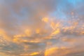 Golden clouds and rainbow on dramatic sky at sunset Royalty Free Stock Photo