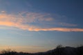 Golden clouds sky over the hill