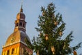 The Golden Cockerel on the clock tower.Riga Cathedral on Dome Square at the historical center in the old town of Riga, Latvia