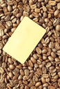 Golden coffee beans with blank frame card for indcription flyer design Royalty Free Stock Photo