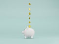 Golden coin flying to white piggy bank on blue background for money saving and deposit concept , creative ideas by 3D rendering Royalty Free Stock Photo