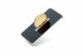 Mobile phone as piggy bank with golden coin on its screen, 3d rendering. Royalty Free Stock Photo
