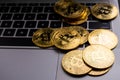 Golden coins with bitcoin symbol on computer keyboard Royalty Free Stock Photo