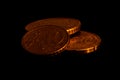 Golden coins on black background stacked