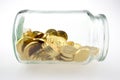 Golden coins in a jar Royalty Free Stock Photo