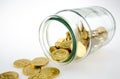 Golden coins in a jar Royalty Free Stock Photo