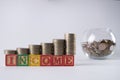 Golden coins in Piggy bank.Income increase concept with upward pile of coins Royalty Free Stock Photo