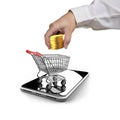 Golden coins, shopping cart, smartphone for mobile payment concept. Royalty Free Stock Photo