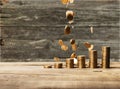 Golden coins stacks on wooden background Royalty Free Stock Photo