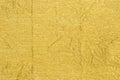 Golden creased metallic foil background texture Royalty Free Stock Photo