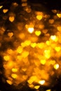 Golden color heart bokeh background photo. Abstract holiday, celebration backdrop. Royalty Free Stock Photo