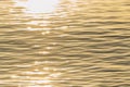 Golden color water ripples.