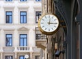 Golden Colored Clock in an Urban Context Royalty Free Stock Photo
