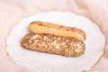 Golden colored eclairs on plate