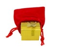 Golden colored gift box placed inside of the red cotton present bag isolated on white background Royalty Free Stock Photo