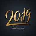 2019 golden colored handwritten inscription on black background. Creative typography for new year holiday greetings. Royalty Free Stock Photo