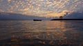 Golden and colorful sunrise sky. Golden sunrise clouds color reflections on water. Morning scenery. Sanur beach nature beach Royalty Free Stock Photo