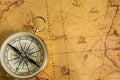 Golden compass on an old map. Selective focus Royalty Free Stock Photo