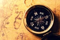 Golden compass on old treasure map Royalty Free Stock Photo