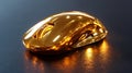 High resolution golden computer mouse resting on a sleek black surface with a reflective sheen