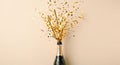 Golden confetti explodes from a champagne bottle in celebration Royalty Free Stock Photo