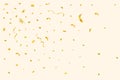 Golden confetti explosion isolated on an off-white background. Golden party tinsel and confetti falling. Festival elements. Royalty Free Stock Photo