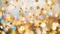 Golden Confetti Falling in a Celebration with Soft Bokeh Lights and Blurred Golden and Blue Circles Royalty Free Stock Photo