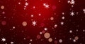 Golden confetti, snowflakes and bokeh lights on the red Merry Christmas background.