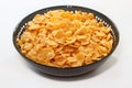 Golden corn flakes in bowl -