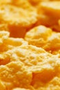 Golden cornflakes background and texture. View from above. cornflakes healthy breakfast, macro Royalty Free Stock Photo