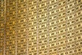 The Golden craft Thai pattern popup on the wall backdrop in some place at Thailand Royalty Free Stock Photo