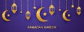 Golden crescent, lantern and stars hanging on dark violet background. Ramadan Kareem long banner. Muslim holy month