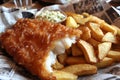 Crispy Fish and Chips Served on Newspaper Royalty Free Stock Photo