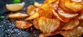 Golden crispy potato chips fried in bubbling oil until perfectly seasoned and crunchy