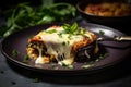 A golden and crispy slice of eggplant parmigiana served on a plate, showcasing its deliciously cheesy topping. Generative AI