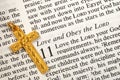 A golden cross on the bible concepts of love