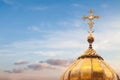 Golden cross dome blue sky background spring easter sunset