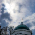 Golden cross on the dome of a Christian Orthodox church against Royalty Free Stock Photo