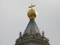 A golden cross on the huge ball at the top of The Santa Maria Chirch at Florence, Italy